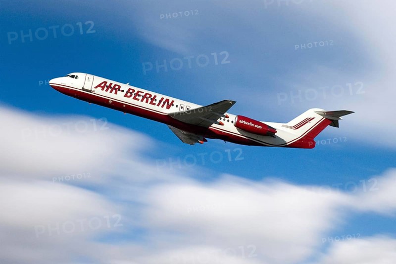 Airplane of Airline Air Berlin, takeoff, with blue sky and white clouds, motion blur showing speed of travel, velocity, Airport Munich, Bavaria, Germany, Europe