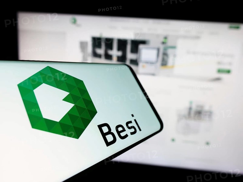 Stuttgart, Germany, 11-11-2023: Cellphone with logo of Dutch company BE Semiconductor Industries NV (Besi) in front of business website. Focus on center of phone display, Europe