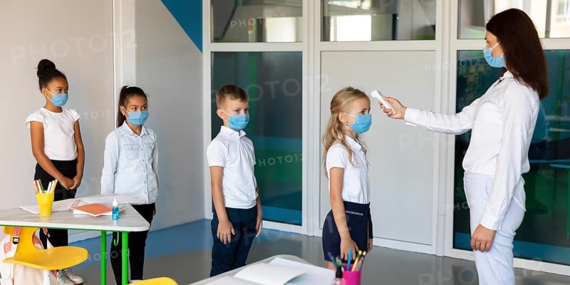 Side view kids waiting line temperature measurements