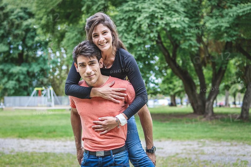 Boyfriend carrying his girlfriend on piggyback