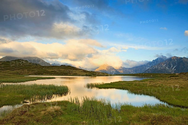 Cloudy sky at Jaufenpass, Passo di Monte Giovo, mountain lake, evening mood, Sterzing, South Tyrol, Italy, Europe