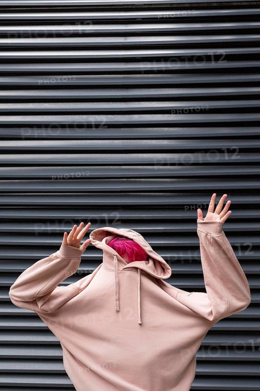 Medium shot teen with pink hoodie