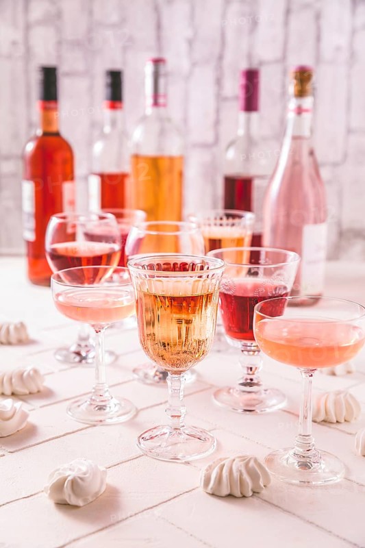 Assortment of rose wine, champagne, cocktails with bottles