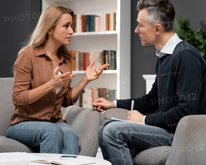Mid shot counselor talking patient