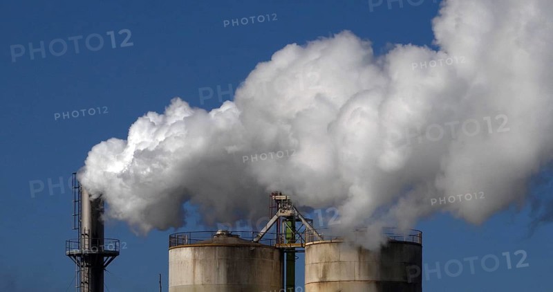 Smokestack of Sugar Refinery with Water Vapour, Near Caen in Normandy