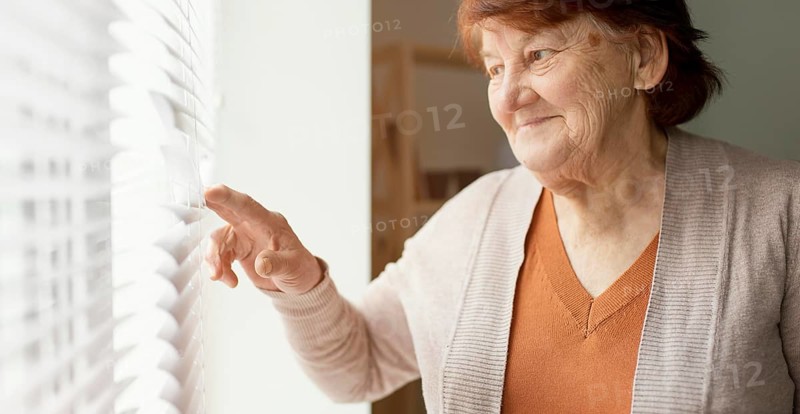 Close up woman looking out window