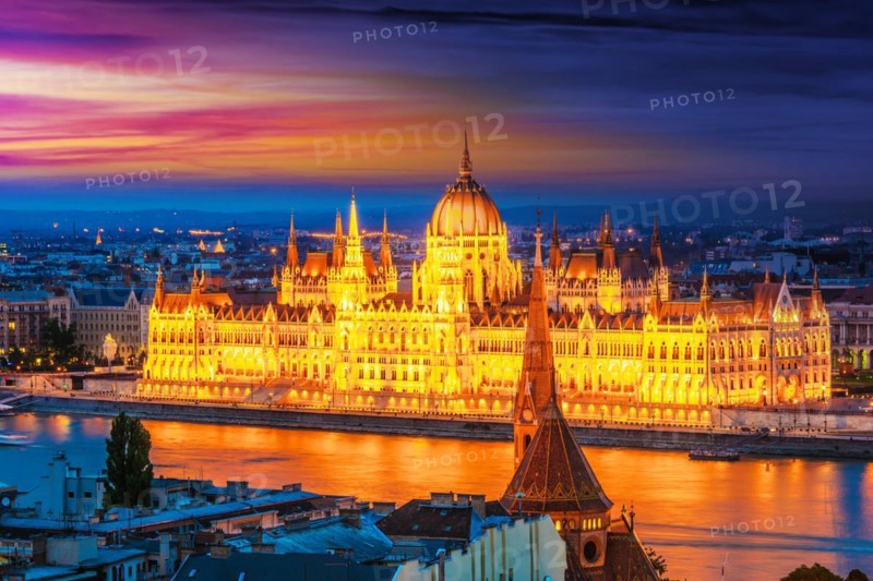 Panoramic view of Budapest with Hungarian Parliament Building on the bank of the Danube after sunset