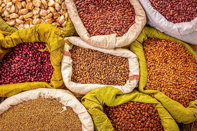 Variety of beans and spices at an organic local market