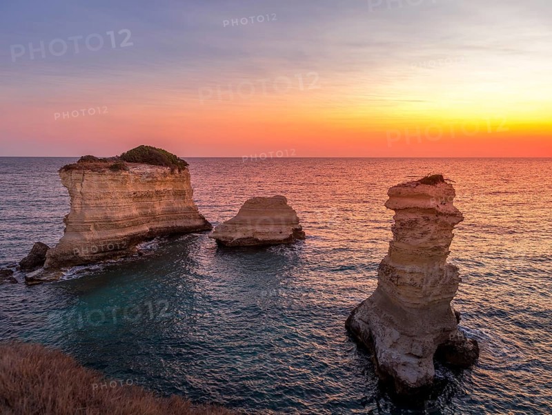 Meledugno town in Italy, Puglia Region. Spectacular view at sunrise on Santo Andrea cliffs