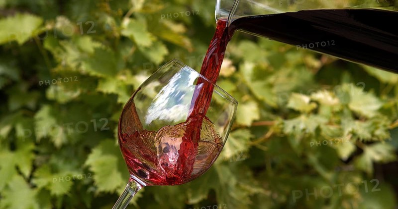 Red Wine being poured into Glass