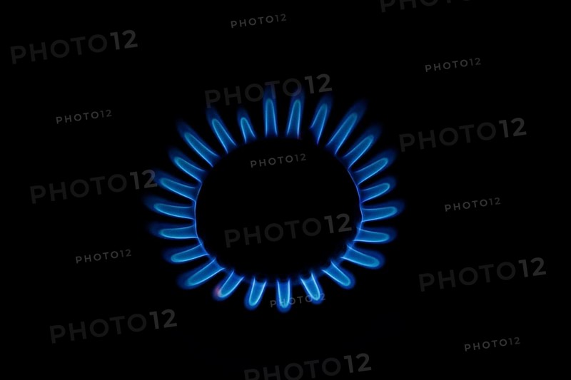 Blue gas flame on a hob, gas cooker, close up