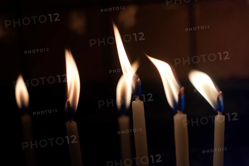 Candle lights in the darkness. Abstract candles background. Hope, fire