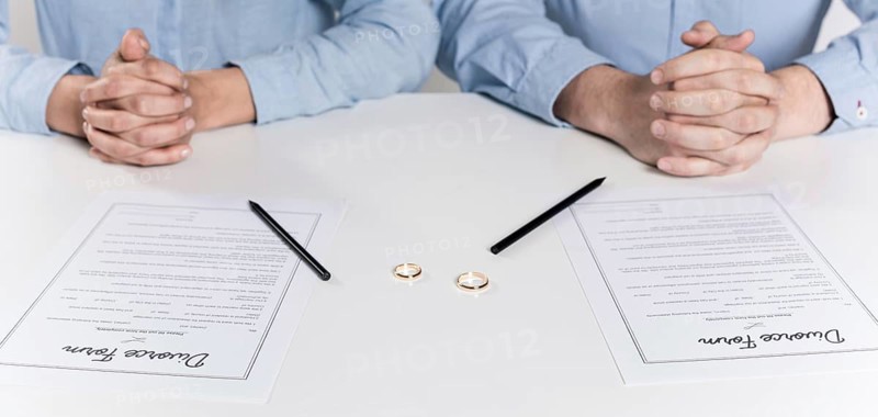 Couple getting ready sign divorce forms