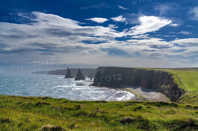 A view of the Duncansby Sea Stacks and wild and rugged coastline of Caithness in the Scottish Highlands