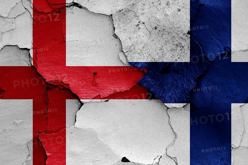 Flags of England and Finland painted on cracked wall