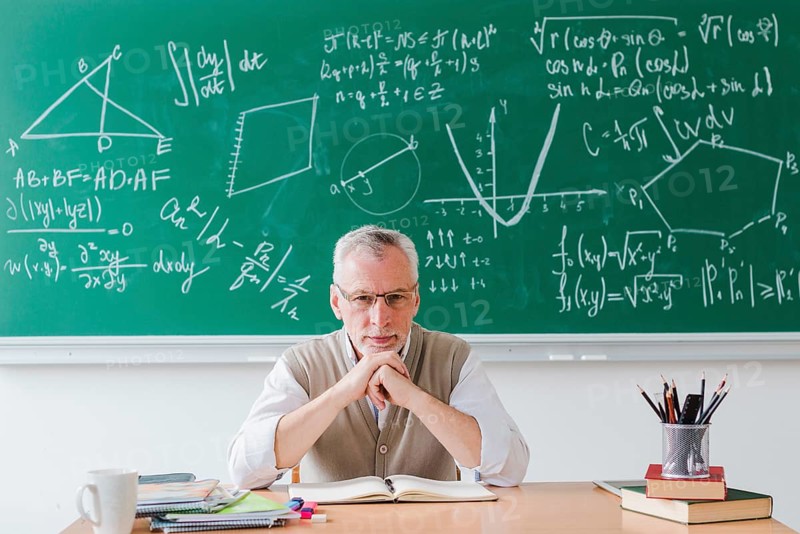 Strict teacher looking camera classroom