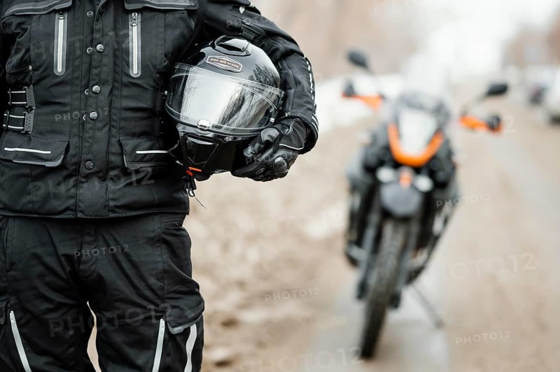 Men riding motorcycle winter day