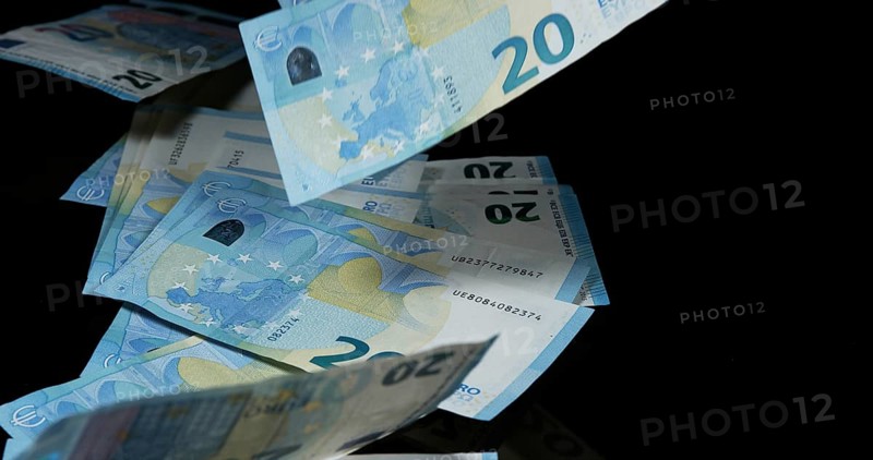 Euros Money Falling against Black Background