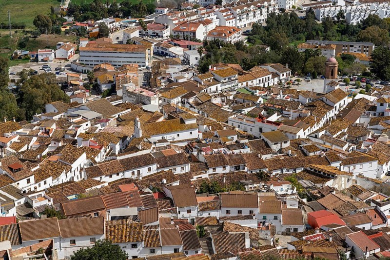 Jimena de la Frontera, Spain - 9 March, 2022: whitewashed village of Jimena de la Frontera high angle view with rooftops and church