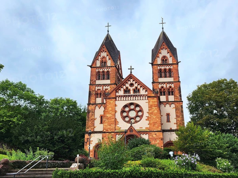 St. Lutwinuskirche in Mettlach is a Catholic parish church built in neo-Gothic style. The church has two towers and a rose window. Mettlach, Merzig-Wadern, Saarland, Germany, Europe