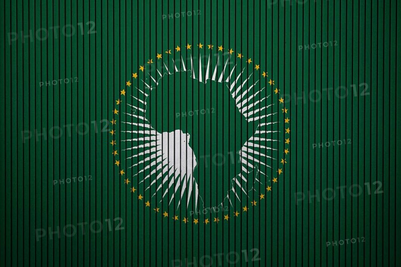 African Union Flag painted on the cracked grunge concrete wall