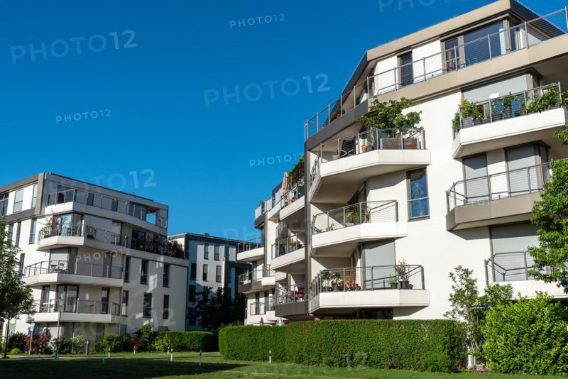 New apartment buildings seen against a blue sky in Munich, Germany, Europe