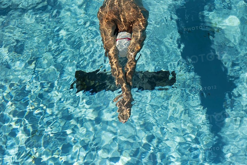 High angle male swimmer water pool