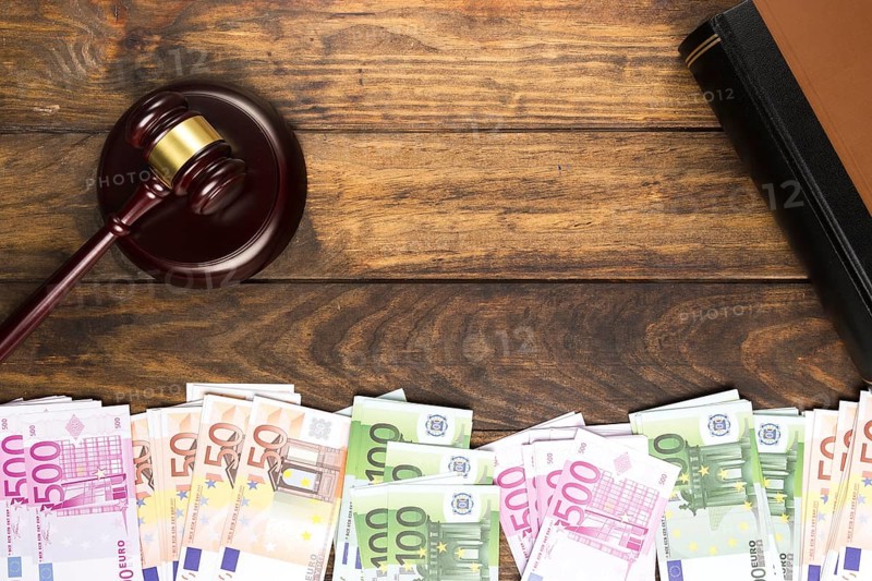 Top view arrangement with judge gavel book money