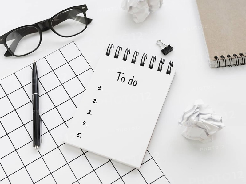 High angle list notepad with glasses pen