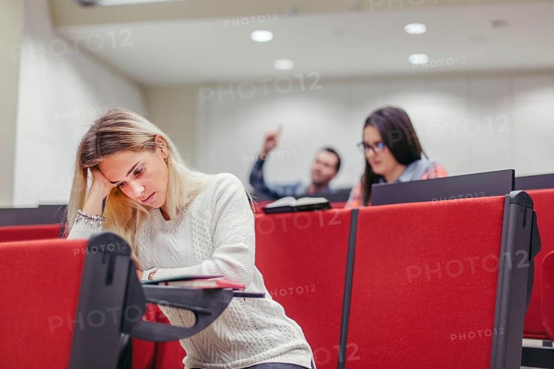 Group students sitting boring seminar