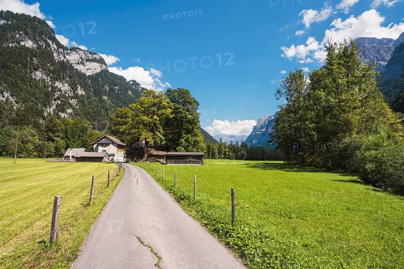 Farm track with farm settlement and Vorauen inn, Klöntal, Canton Glarus, Switzerland, Europe