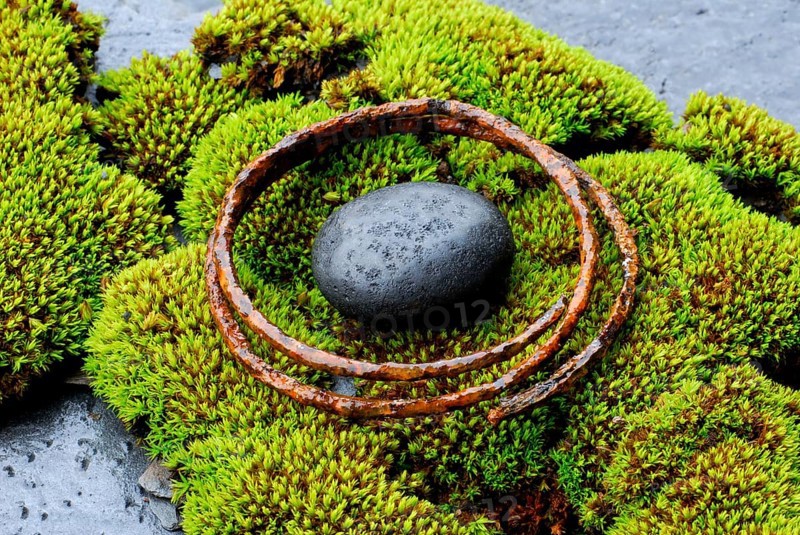 Stone and rusty metal ring