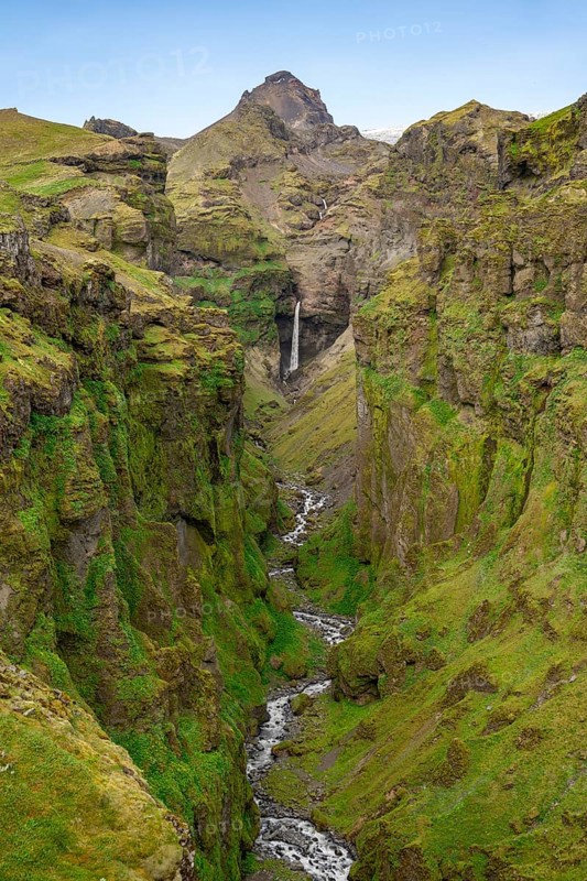 Mountain landscape with green canyon, waterfall and river in Múlagljúfur Canyon, Sudurland, Iceland, Europe