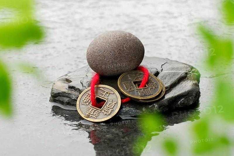 Stones and Chinese lucky coins, coins, lucky coins, lucky coin, coin, in water