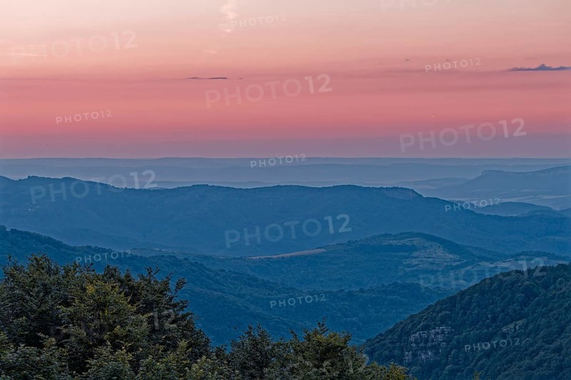Dawn over the mountain landscape of the Balkan Mountains and the wooded slopes of the Balgarka nature park Park in Central Bulgaria. Shipka, Gabrovo, Bulgaria, South-East Europe, Europe