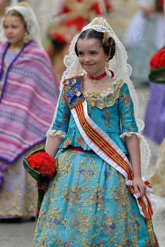 Fallas festival, girl in a traditional costume during the parade in the Plaza de la Virgen de los Desamparados, Valencia, Spain, Europe