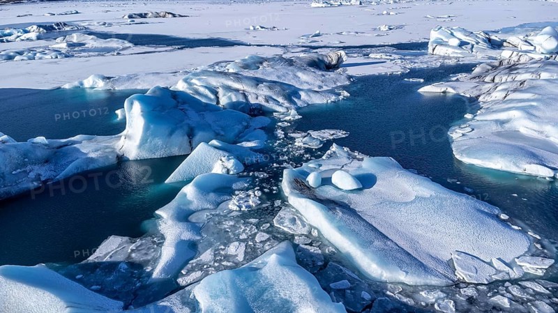 Aerial drone view of floating icebergs in Jokulsarlon glacier lagoon in Iceland