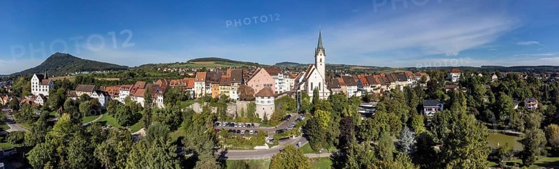 Aerial view of the town of Engen with the Church of the Assumption of the Virgin Mary, on the left the Hegau volcano Hohenhewen