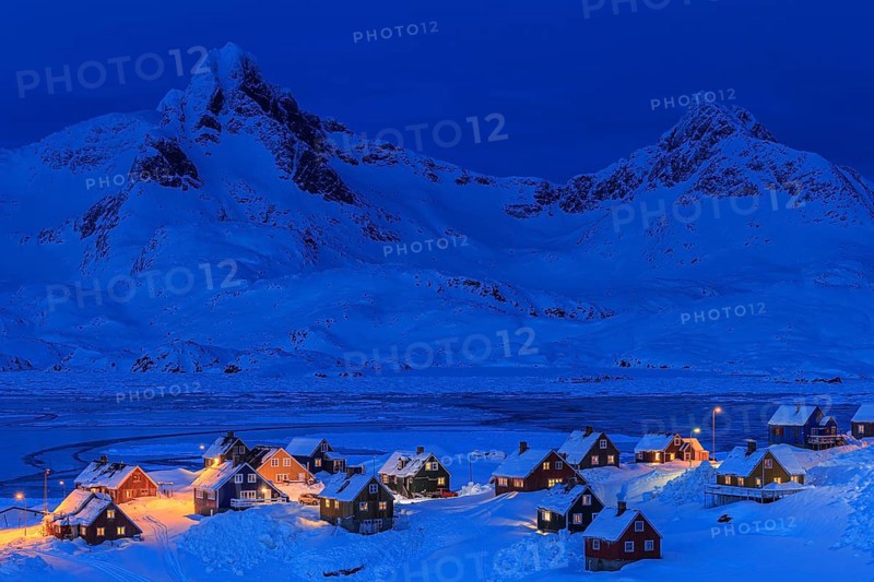 Inuit settlement, houses in deep snow in front of mountains, blue hour, twilight, winter, Tasiilaq, East Greenland, Greenland, North America