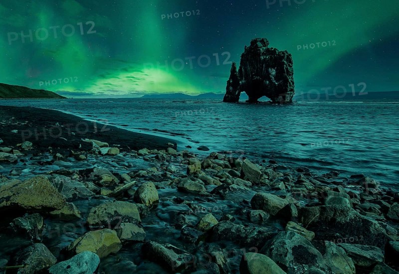 Hvitserkur landscape at night with beautiful Northern Lights. Iceland