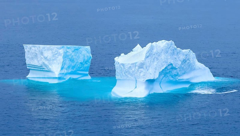 Iceberg seen from cruise ship vacation near Greenland coast in Arctic circle near Ilulissat Disko Bay