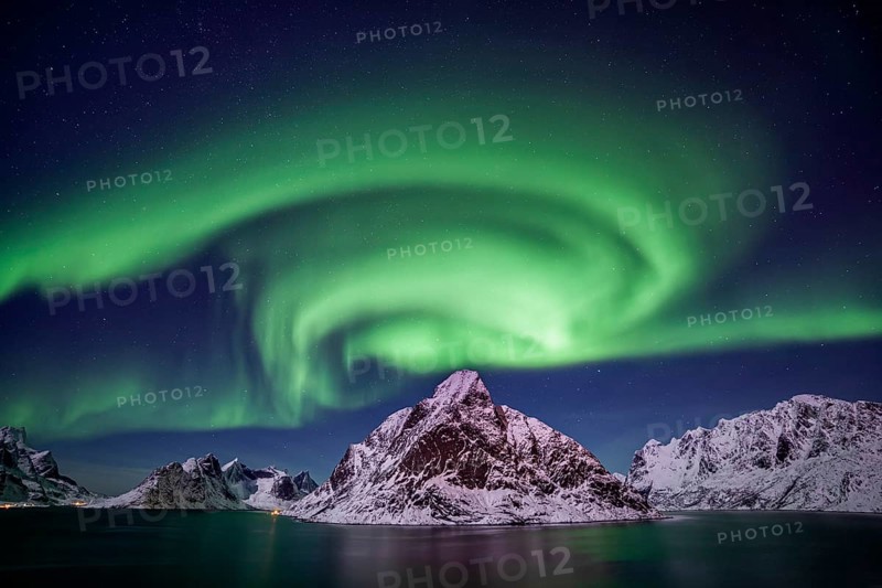 Green northern lights reflected in fjord, steep mountains, aurora borealis, winter, Reine, Moskenesoya, Lofoten, Norway, Europe