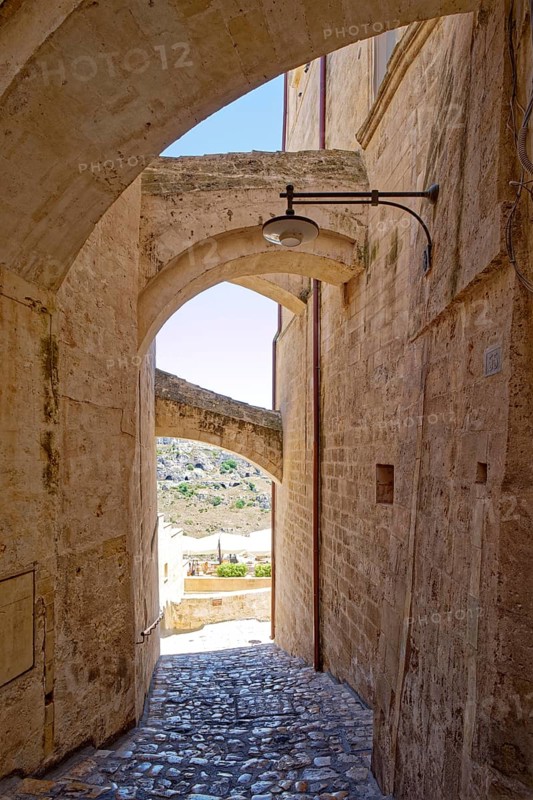 Paths and corridors in the tuff of the Sassi Barisano in the cave town of Matera. The cave settlements, Sassi, are a UNESCO World Heritage Site. Matera, Basilicata, Southern Italy, Southern Europe