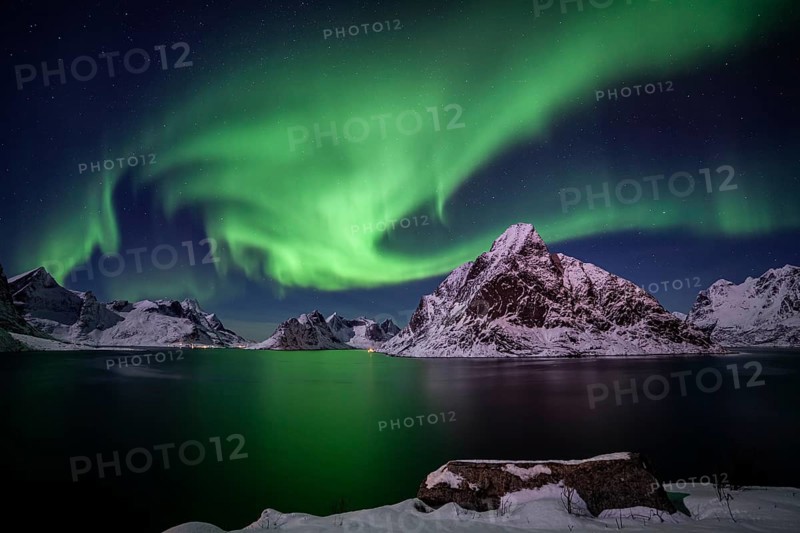 Green northern lights reflected in fjord, steep mountains, aurora borealis, winter, Reine, Moskenesoya, Lofoten, Norway, Europe
