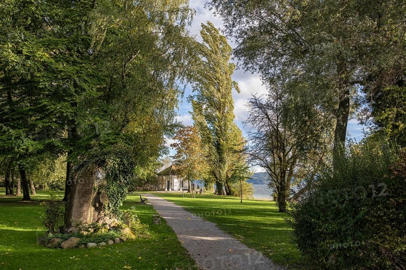 Footpath through Mettnaupark with memorial stone by the poet Joseph Victor von Scheffel and the Urkundenhäuschen, Radolfzell am Lake Constance, Konstanz district, Baden-Württemberg, Germany, Europe