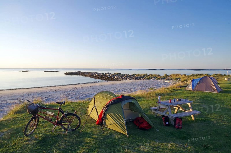 Camping on a quiet beach at dusk with tent, bike and picnic table, cycling holidays, adventure holidays, Bleik, Vesteralen, Langoya, Nordland, Norway, Europe