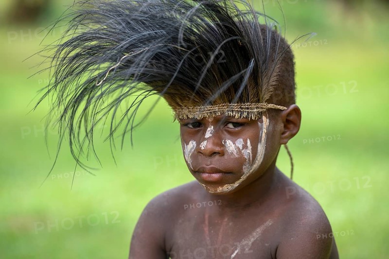 Native boy with cassowary feather headdress, village of Mutin, Lake Murray, Western Province, Papua New Guinea, Oceania