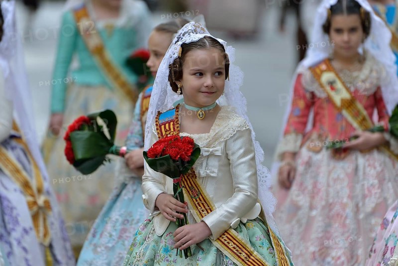 Fallas festival, girls in a traditional costume during the parade in the Plaza de la Virgen de los Desamparados, Valencia, Spain, Europe