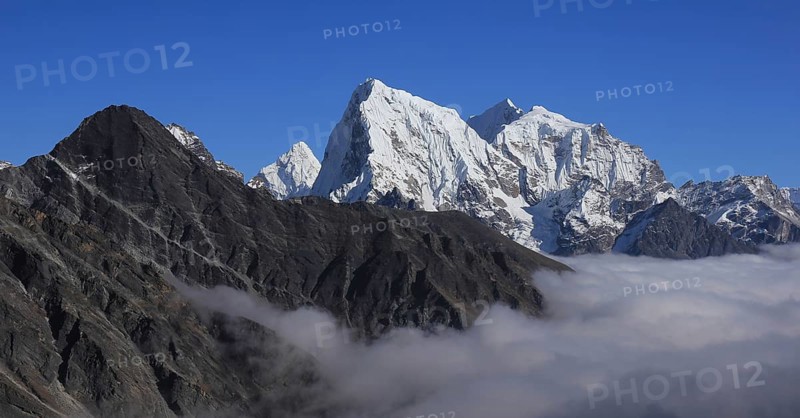 Sea of fog in the Gokyo Valley and peaks of Ama Dablam, Cholatse and Tobuche