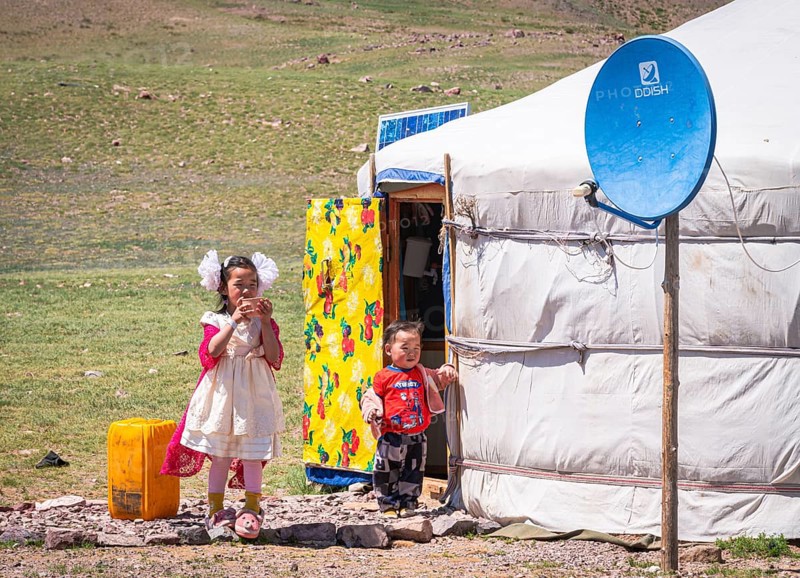 Nomad kids out of yurt looking at me. Summer time in Gobi-Altai province8 Mongolia